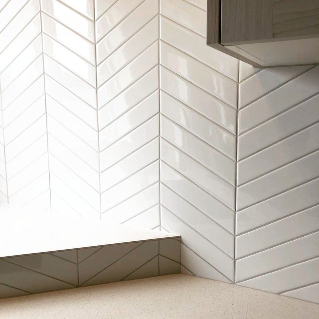 Detail of chevron tile pattern with tight joints at an inside corner