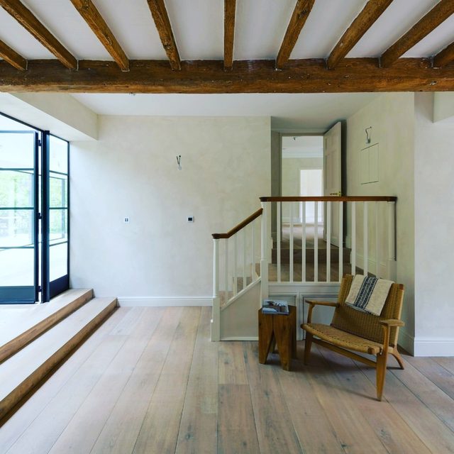 Wood plank flooring with finished nosing at a step and stairs